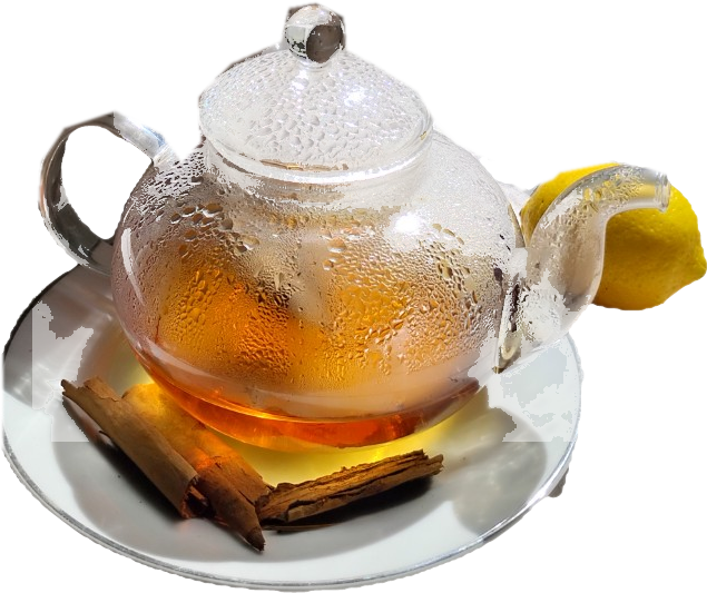 A glass teapot of amber tea on a plate with cinnamon sticks and a lemon